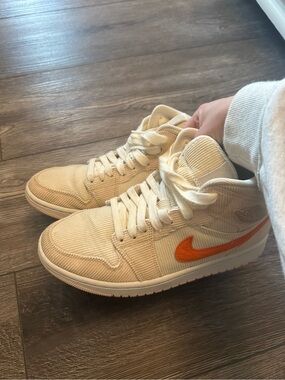 Women’s pink and orange corduroy air jordan 1s mid se